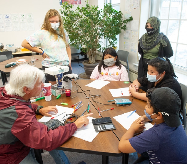 Chris Shively working with students at the Community Academic Center