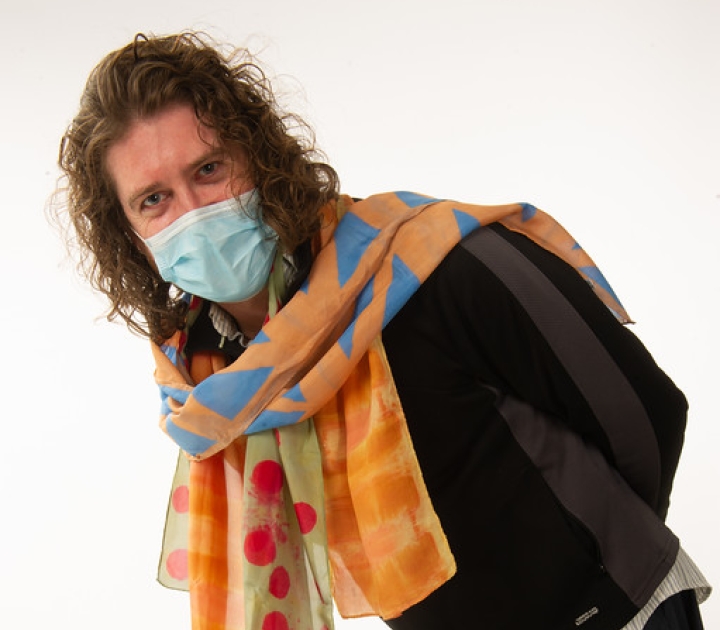 Student Robert Winslow modeling his silk scarf