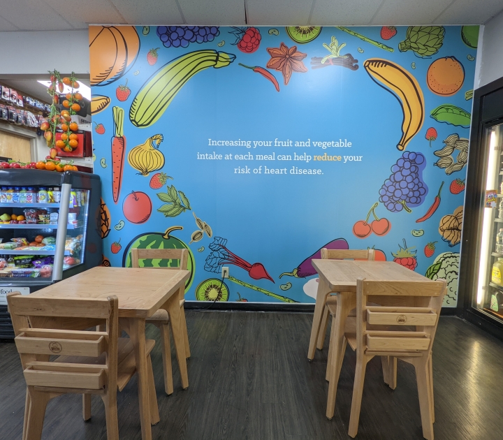 Wall mural and tables and chairs designed by Buffalo State students