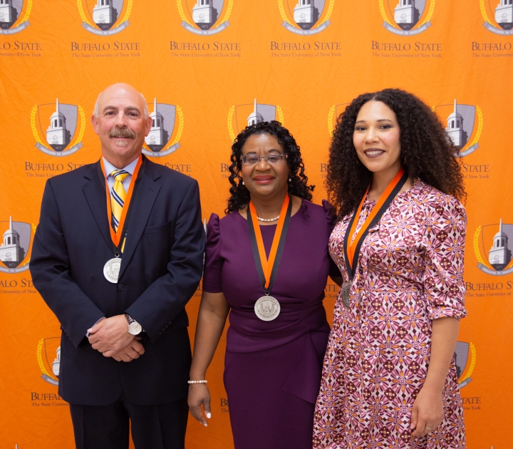ick Kennedy, Rose Thevenin, and Julia Bottoms pose for a photo