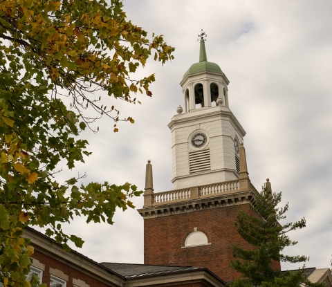 Bell tower of Rockwell Hall framed by trees
