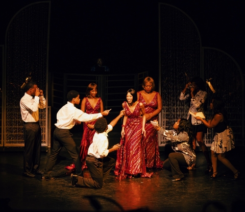 Cast members of Dreamgirls in a scene