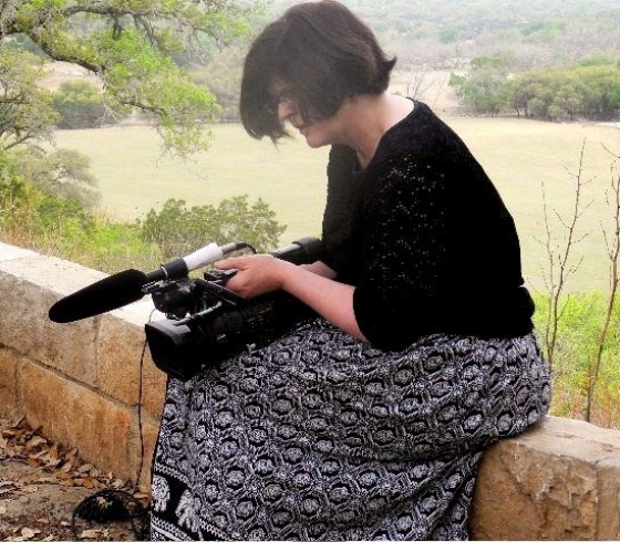 Meg Knowles adusting her camera