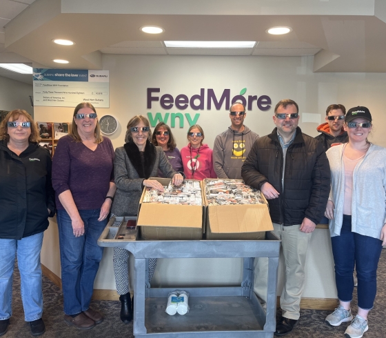 individuals with eclipse glasses on