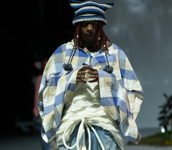 Male student modeling at fashion show