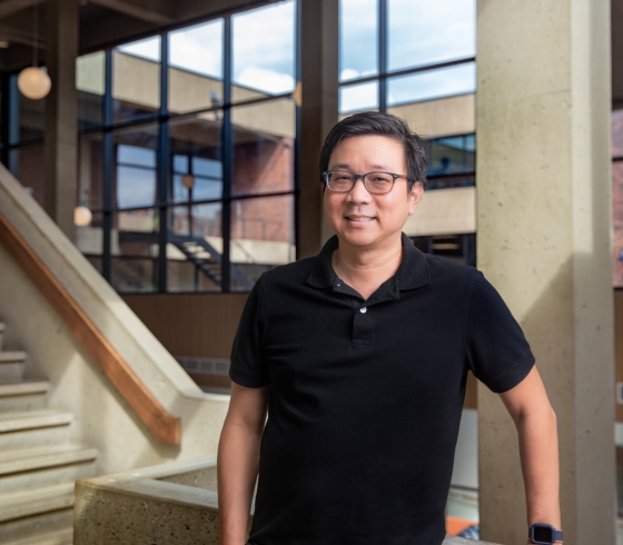 Ken Fujiuchi posing on the library stairs