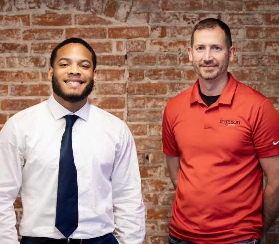 Paul Perry with a Buffalo State student