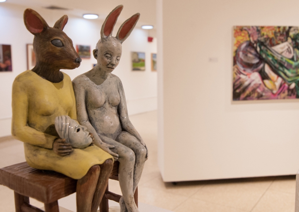 Whimsical sculpture of animal-people