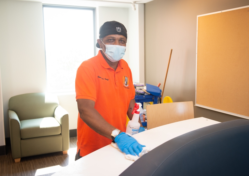 custodial staff cleaning