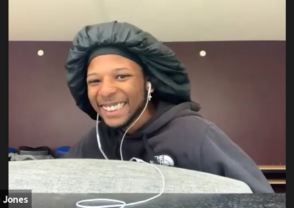 Sencere Jones smiling when he learns the news of his award