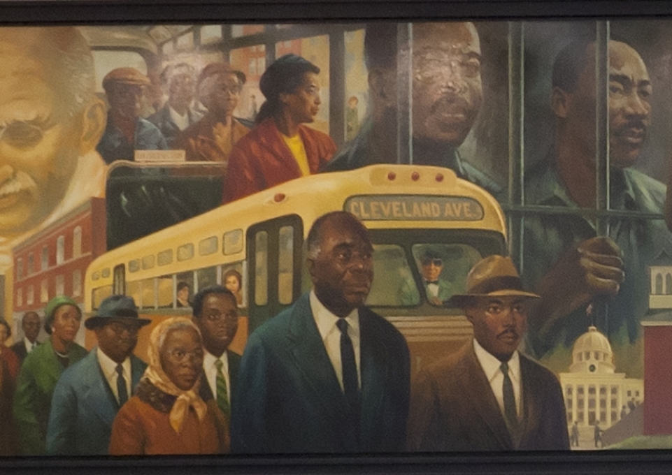 Colorful painted mural depicting notable scenes from Black historical events