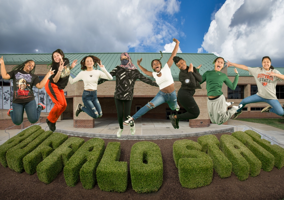 Students from the Urban Teachers Academy program jumping in the air