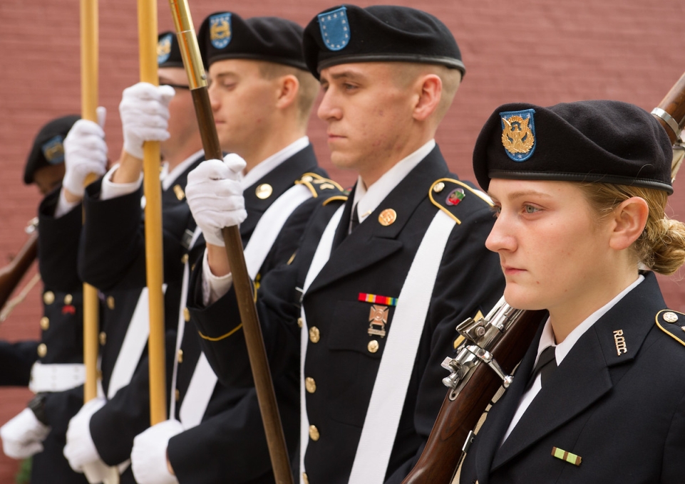 Veterans in uniform lined up for silent march