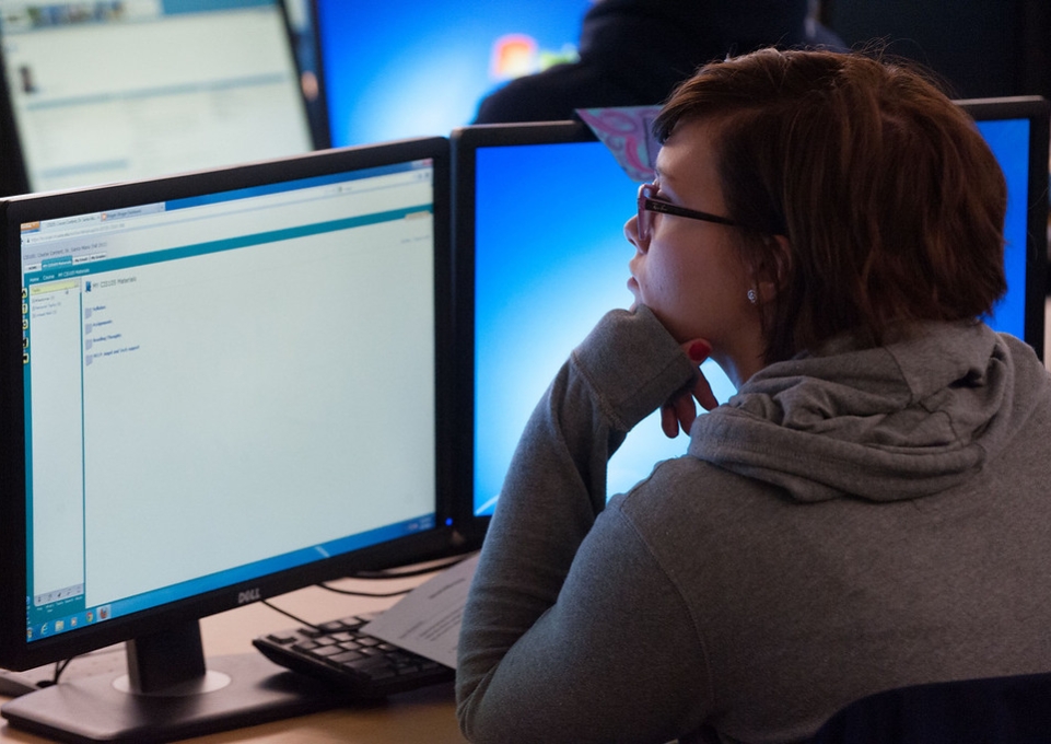 Student looking at a computer monitor