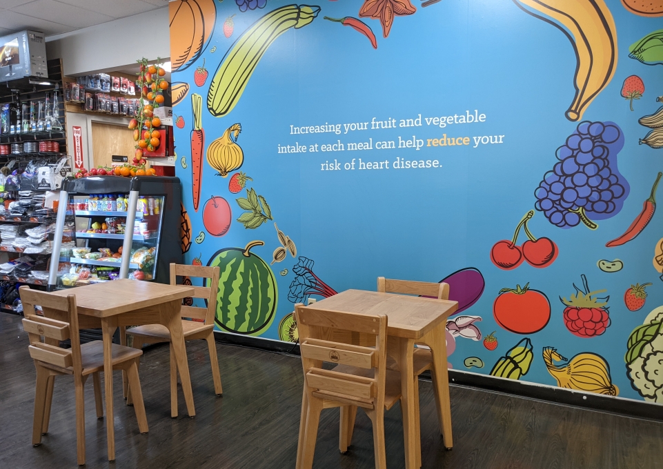 Wall mural and tables and chairs designed by Buffalo State students