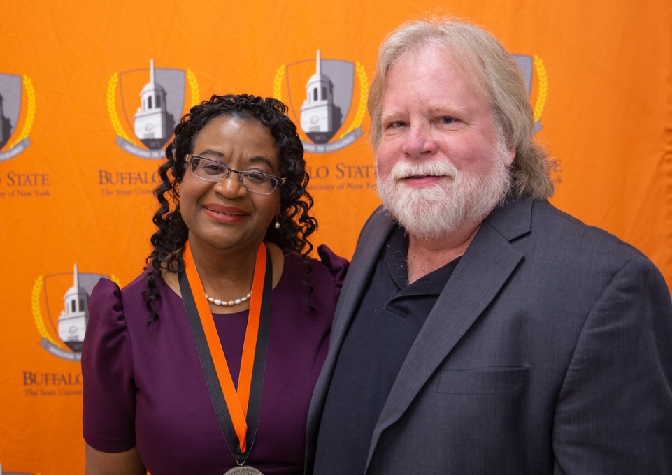 Rose Thevenin poses with David Carson, former chair of history and social studies education, and Julia Bottoms pose for a photo