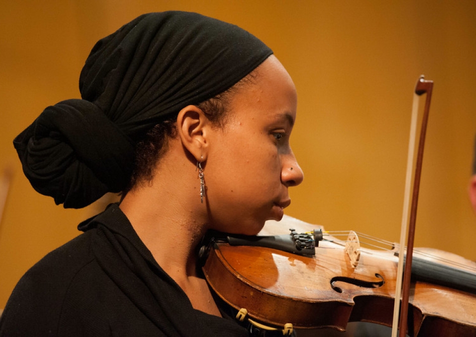 Young woman playing the violin