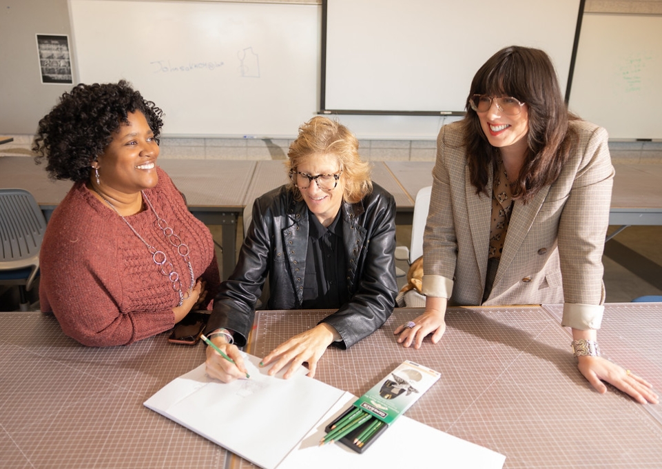 Shantell Reid, student Lisa SiemerHarvey and Erin Habes from Buffalo State's fashion and textile technology program.