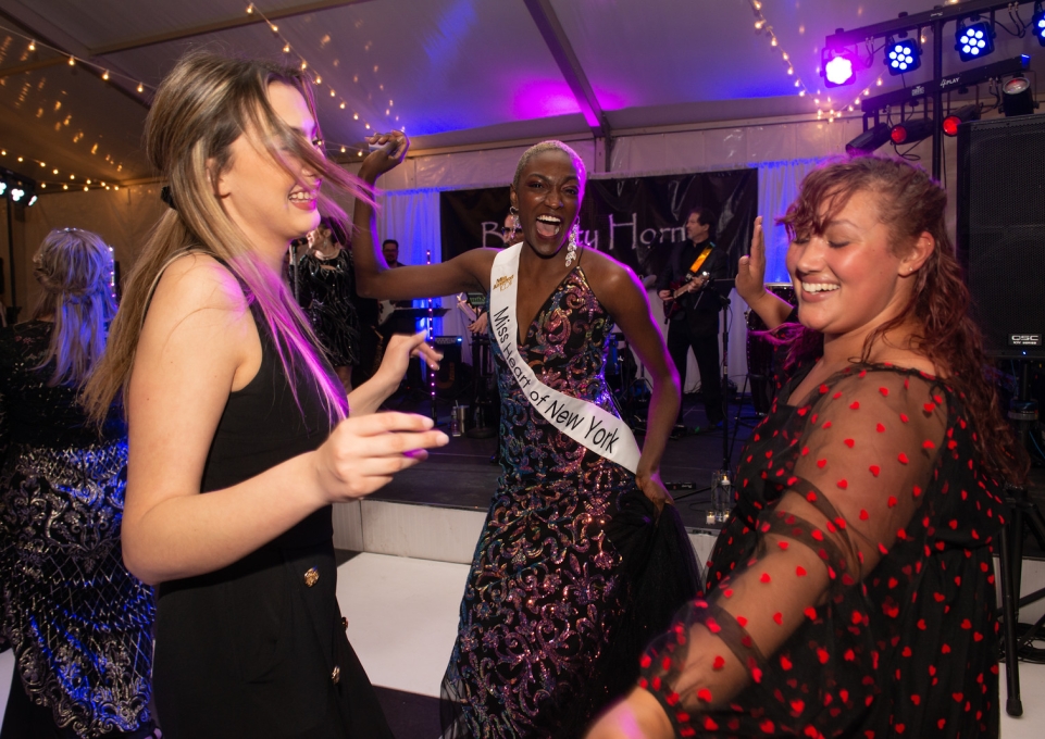 Three students dancing at the gala