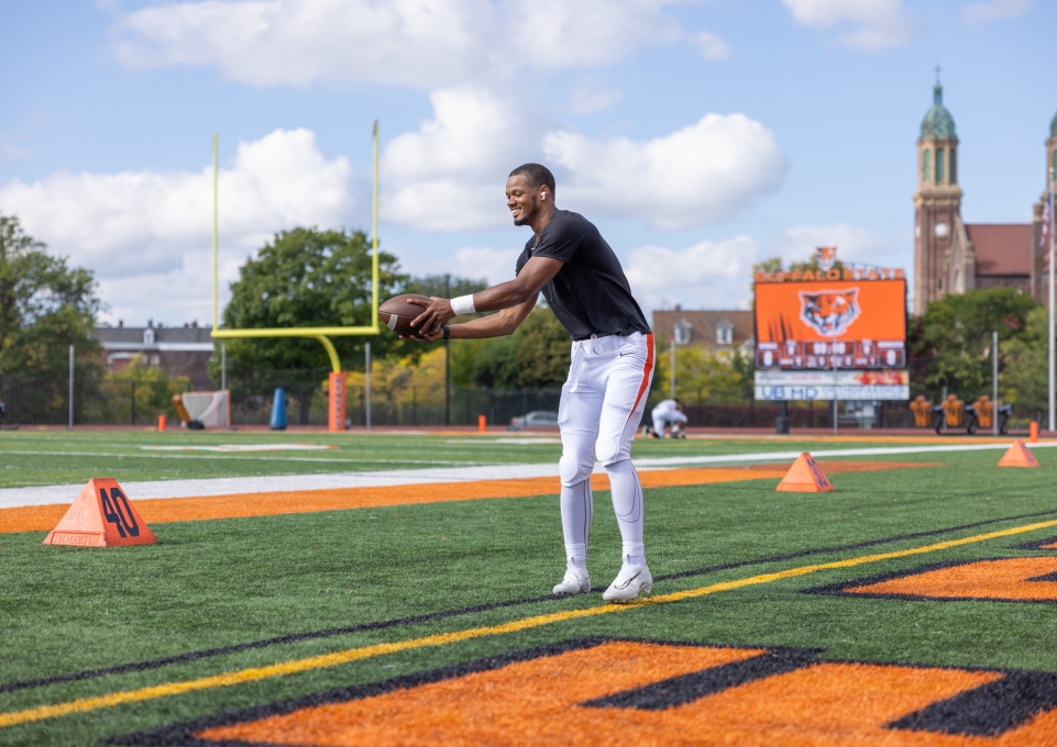 Student catches a football