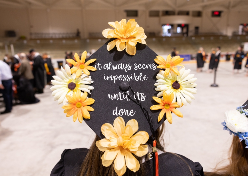 Graduation cap that reads "It always seems impossible until it is done"