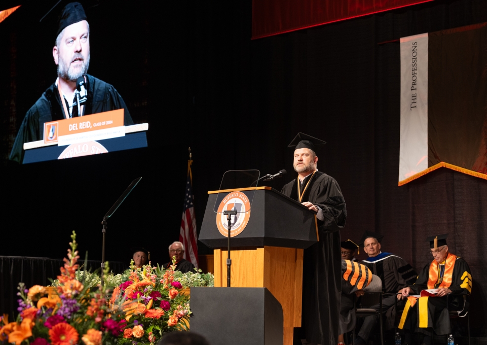 Del Reid speaking at Commencement