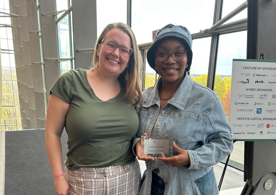 Jada and Olivia holding 3rd place plaque